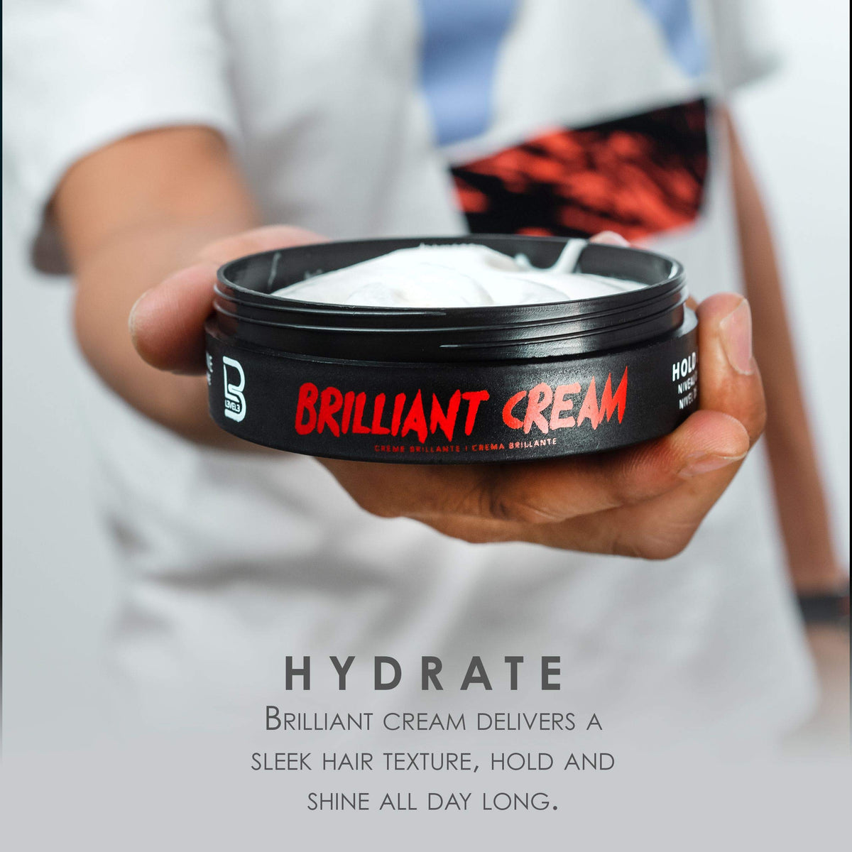 L3 applying cream to hair roots demonstrating effortless distribution and improved manageability