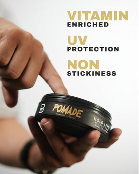 L3 pomade being scooped into hands demonstrating easy application and non-sticky feel