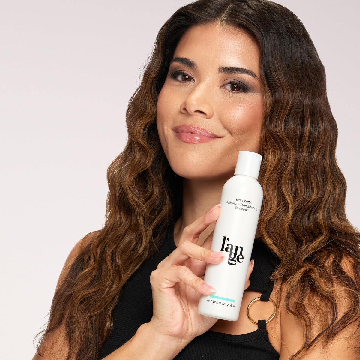 L'ANGE HAIR lifestyle shot of smooth styled hair showcasing stronger, shinier results