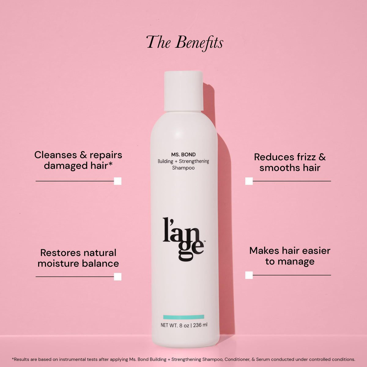 L'ANGE HAIR 8 fl oz bottle staged for travel emphasizing portability