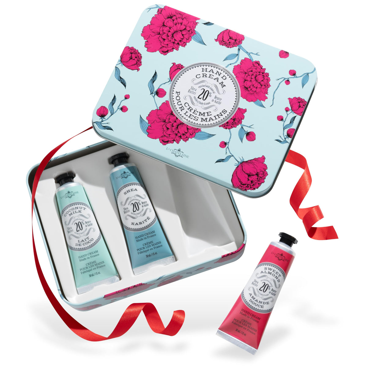 La Chatelaine front view of three travel tins showing neat gift-ready packaging and convenience