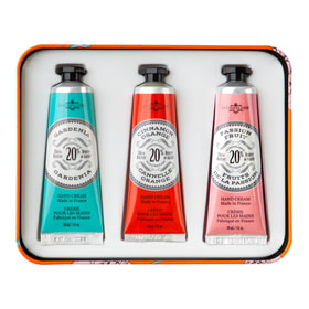 La Chatelaine three hand cream tubes lined up displaying scent variety and portability