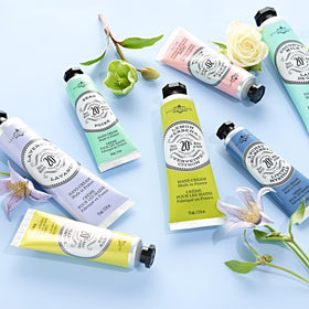 La Chatelaine tins in a purse showing travel-friendly size and convenience