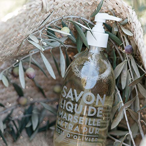 La Compagnie de Provence bottle on bathroom vanity creating a warm, natural ambiance