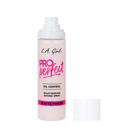 L.A. Girl bottle next to common items to show size and portability benefit