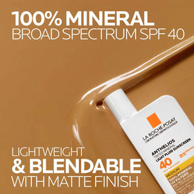 La Roche-Posay product spread on hand demonstrating blendable tint benefit