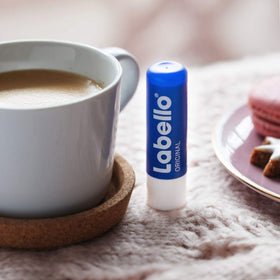 Labello applied outdoors with benefit of lip protection during activities