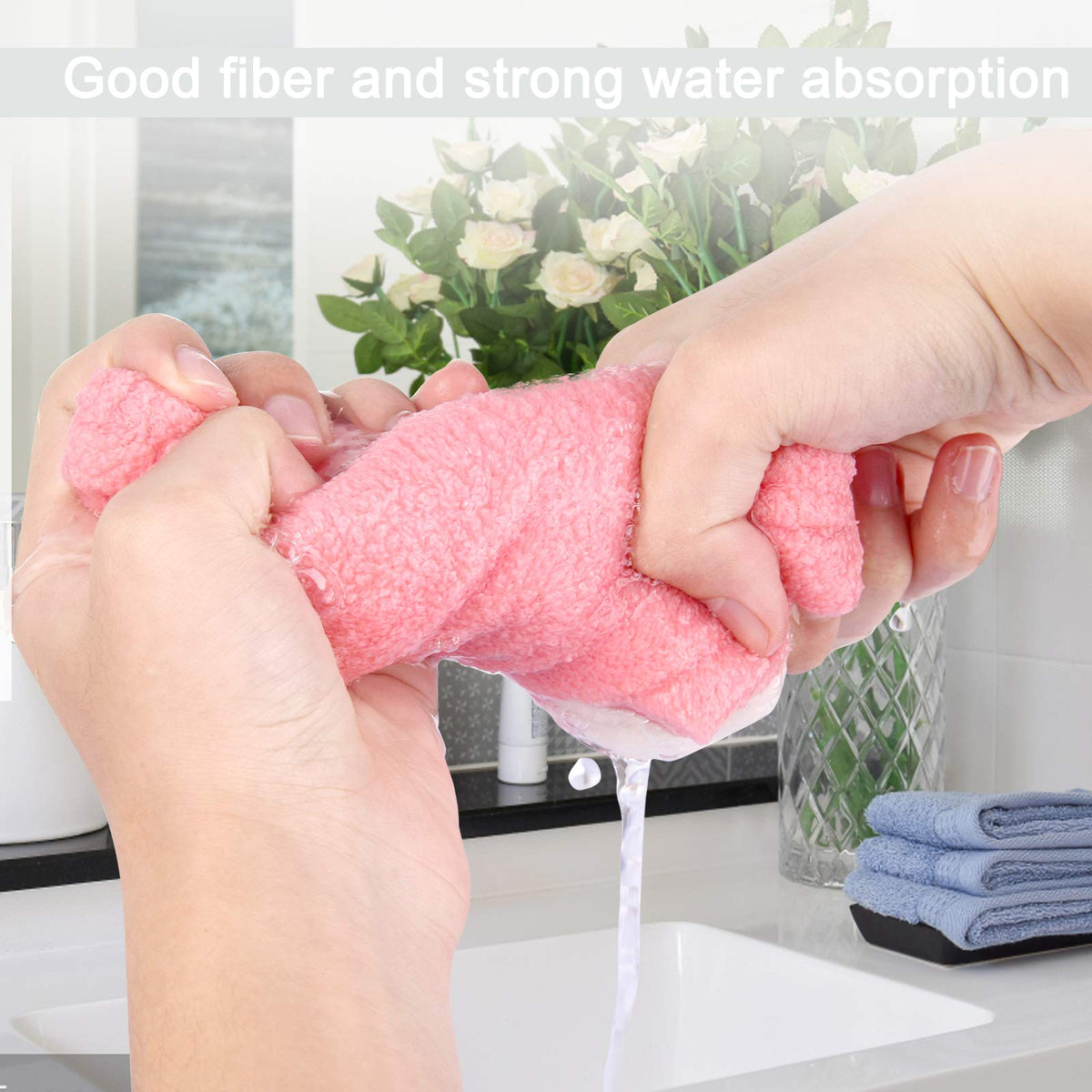Lamoutor towel beside child's hand for scale showing compact size and easy handling