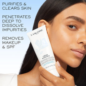 Lancôme cleanser in hand being worked into foam demonstrating effective makeup removal benefit