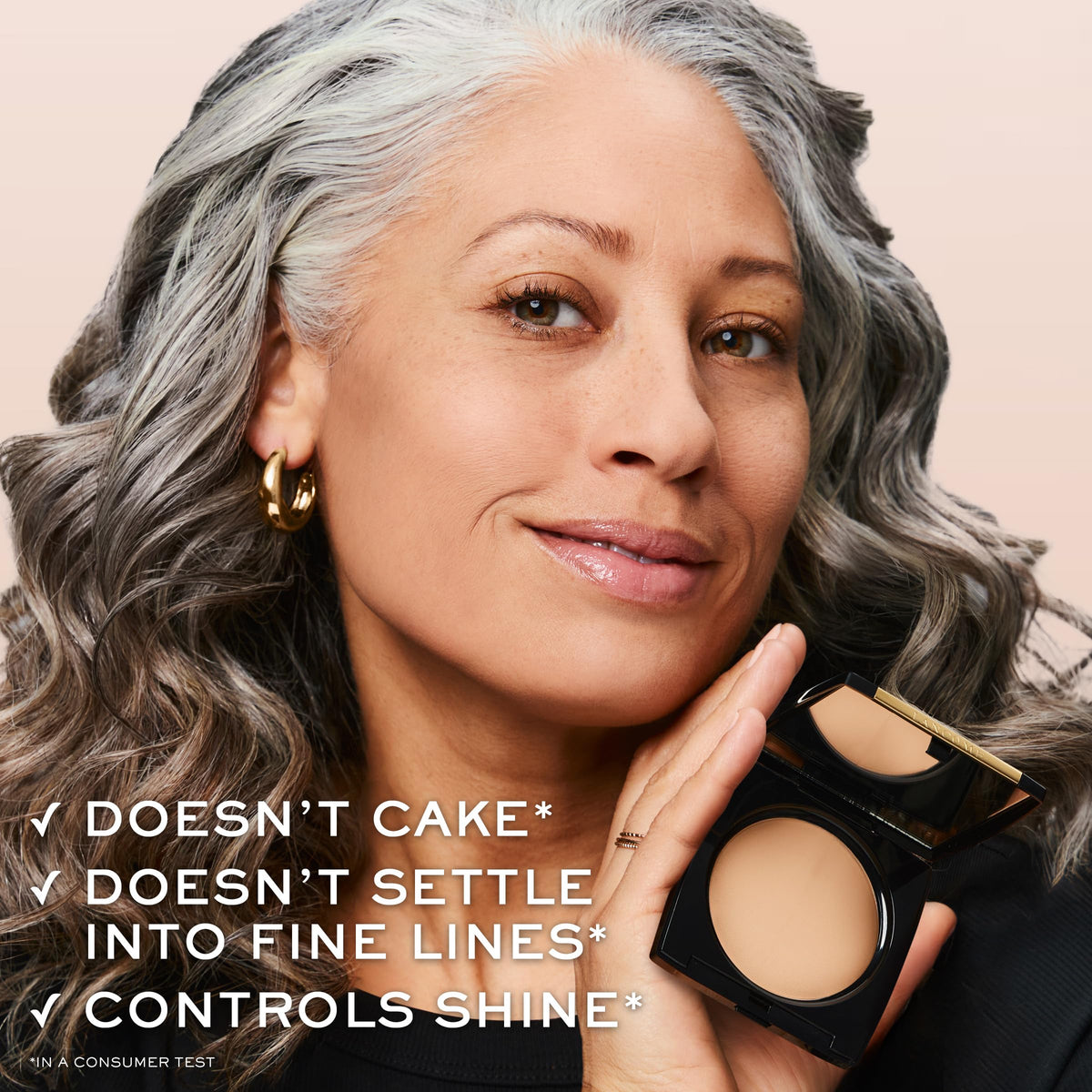 Lancôme compact next to coin showing size for travel-friendly convenience