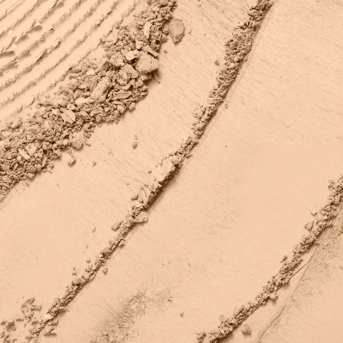 Lancôme close-up of powder texture showing smooth creamy finish benefit