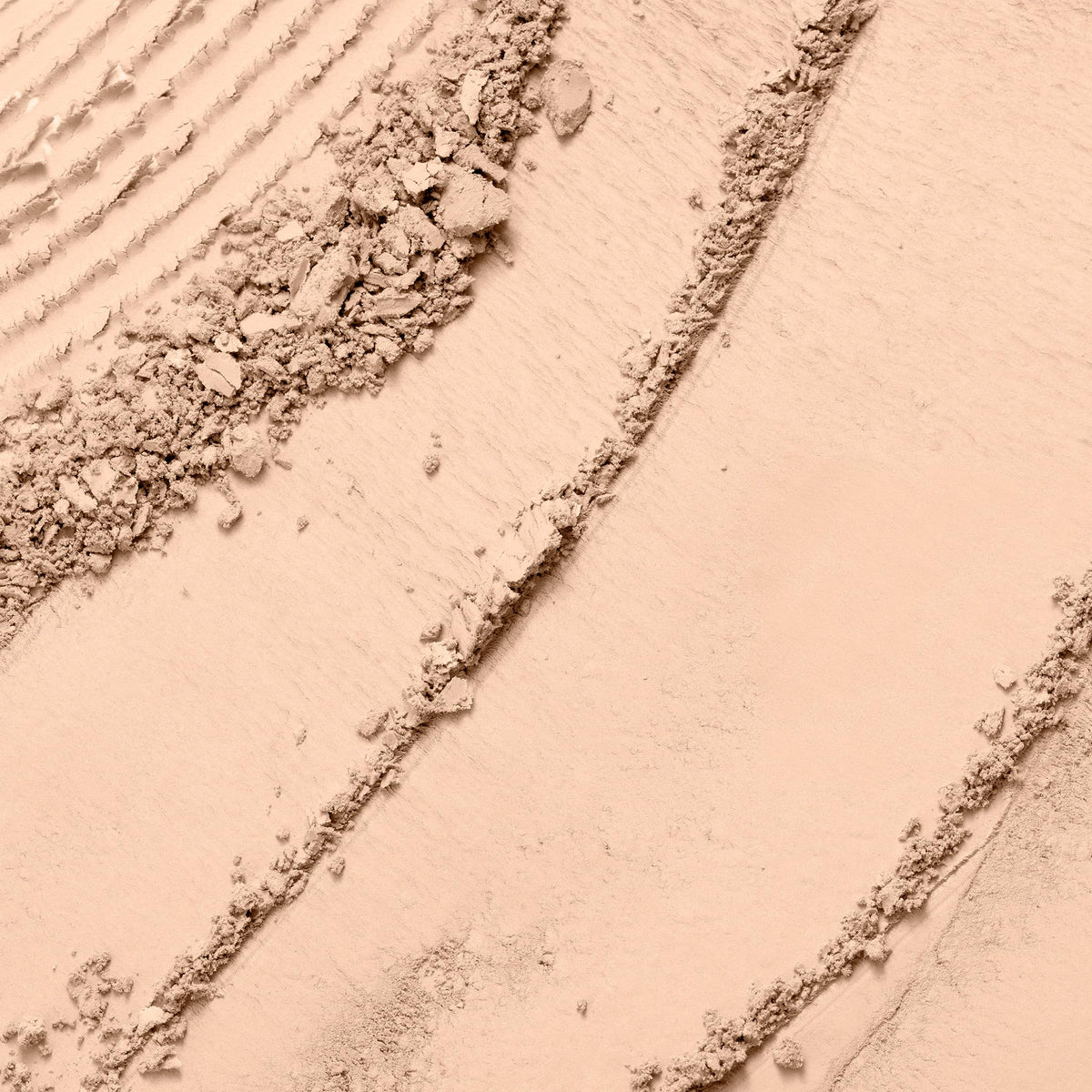 Lancôme close-up of powder surface texture highlighting fine-milled finish for smooth application