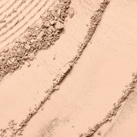 Lancôme close-up of powder surface texture highlighting fine-milled finish for smooth application