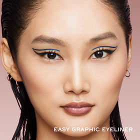 Lancôme Idôle Liner beside a coin showing compact size and travel-friendly convenience