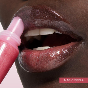 Lancôme Juicy Tubes held in hand illustrating compact size and portability