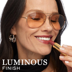 Lancôme lipstick staged in elegant clutch suggesting day-to-night versatility