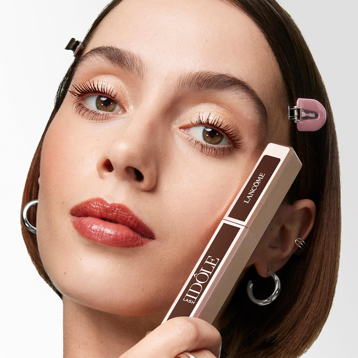 Lancôme before and after eyes showing lifted, fanned-out lashes instantly