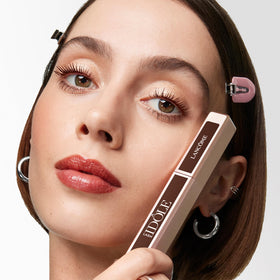 Lancôme before and after eyes showing lifted, fanned-out lashes instantly