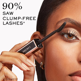 Lancôme mascara placed on vanity alongside makeup, suggests everyday elegance