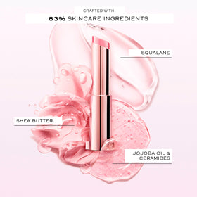Lancôme Lip Idôle swatch on hand demonstrating buildable berry color and shine
