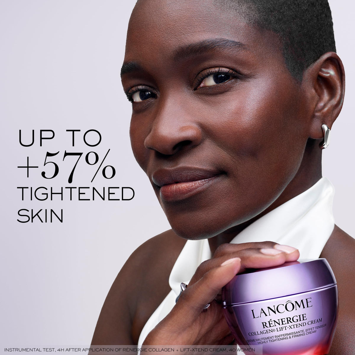 Lancôme hand applying cream to face demonstrating use and instant tightening benefit