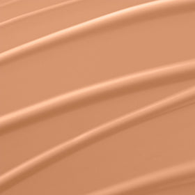 Lancôme bottle pump dispensing foundation showing smooth hydrating texture