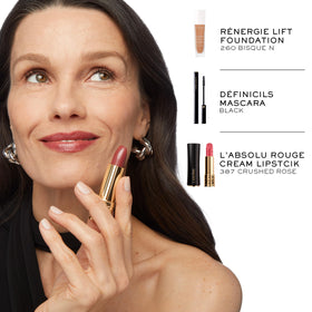 Lancôme beside a coin to show compact size and portable convenience