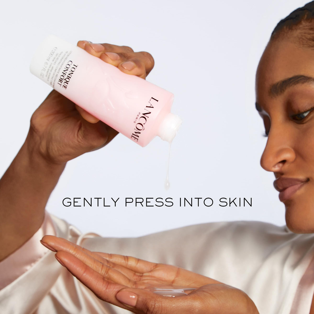 Lancôme toner on bathroom shelf styled lifestyle scene suggesting daily routine elevation