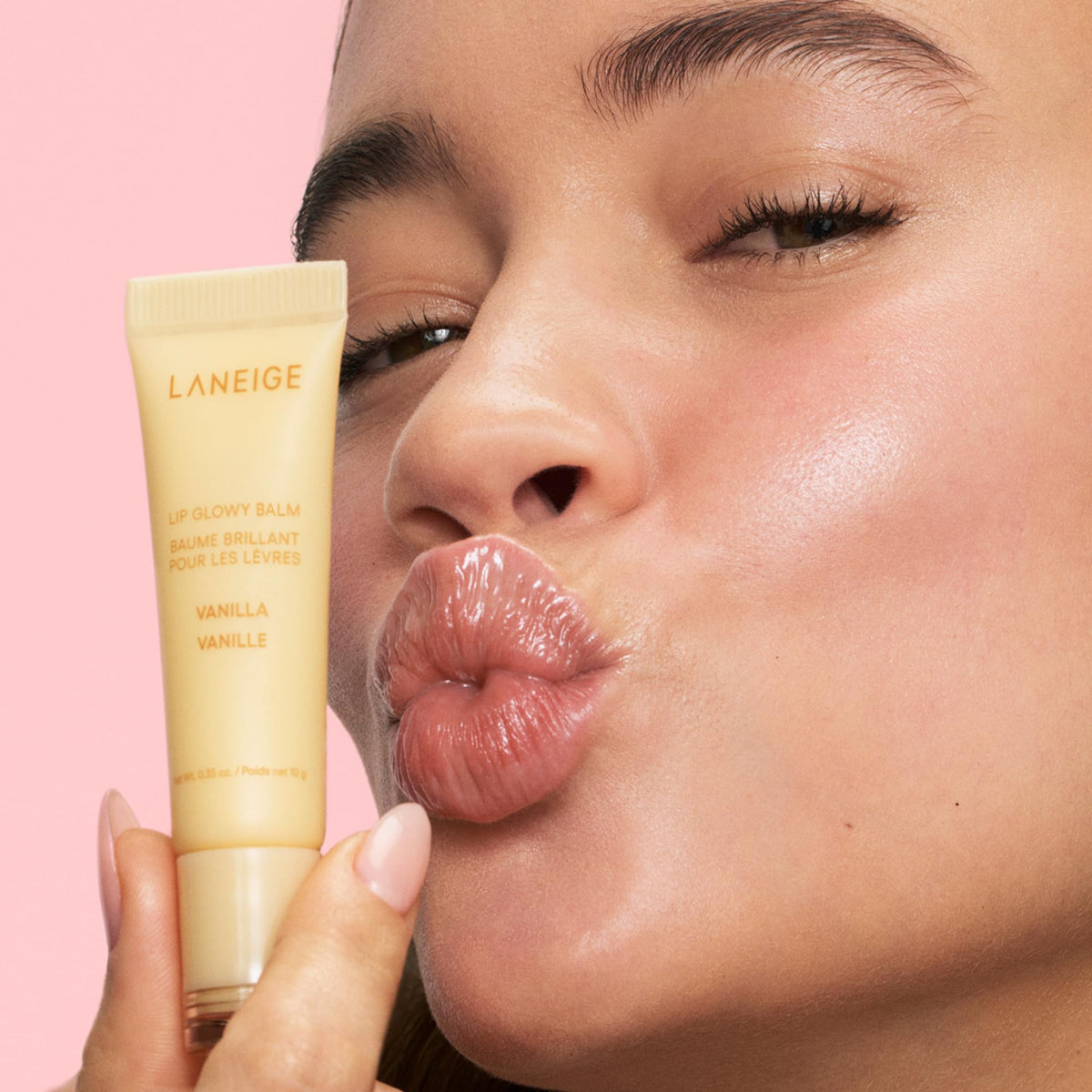 LANEIGE Lip Glowy Balm angled close-up showing creamy stick for instant shine benefit