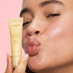 LANEIGE Lip Glowy Balm angled close-up showing creamy stick for instant shine benefit