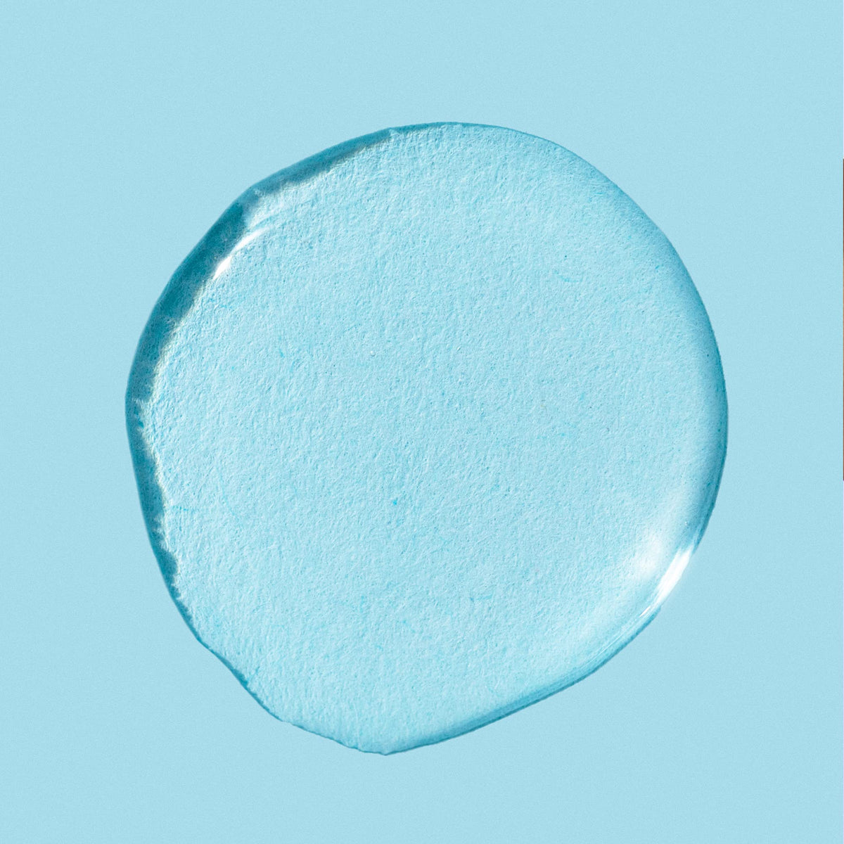 LANEIGE bottle being applied to cotton pad, illustrating easy exfoliation and prep