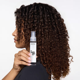 L'ANGE HAIR applied to dry hair smoothing frizz for a polished finish