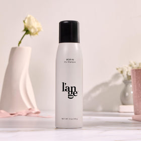 L'ANGE HAIR in a travel bag lifestyle shot and convenient on-the-go use