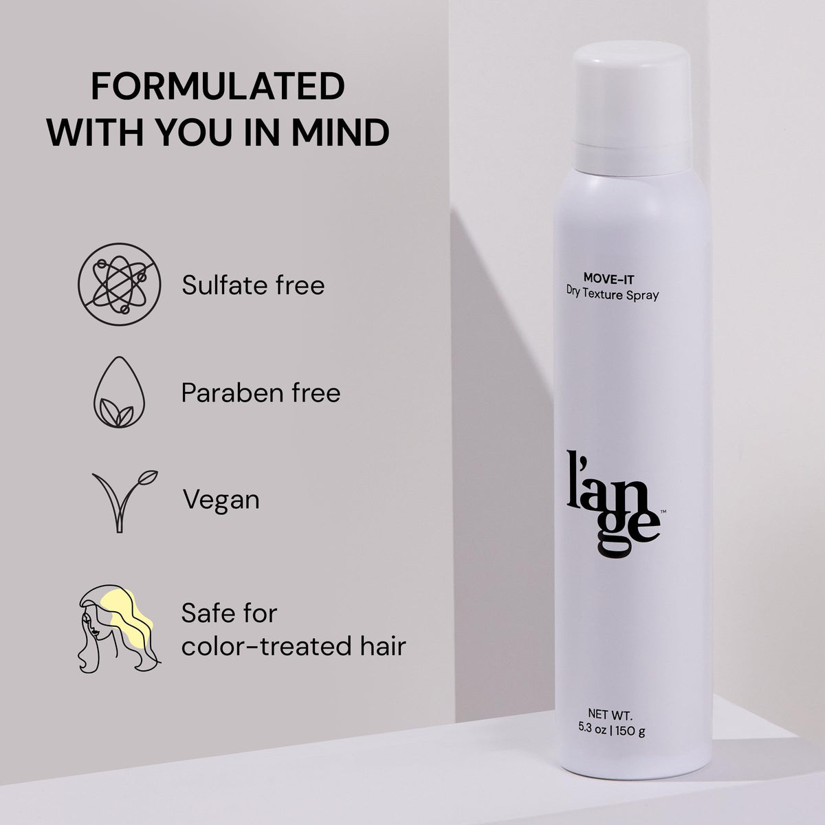 L'ANGE HAIR applying spray at roots to absorb oil and instantly refresh hair