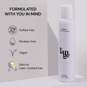 L'ANGE HAIR applying spray at roots to absorb oil and instantly refresh hair