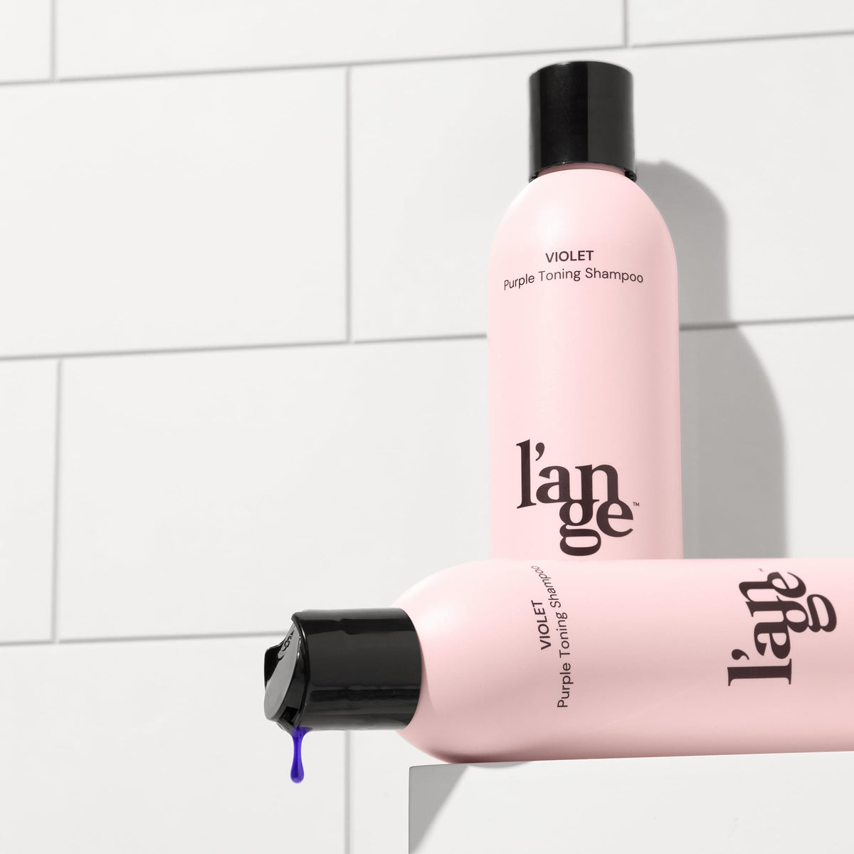 L'ANGE HAIR purple suds in hand highlighting conditioning texture and shine