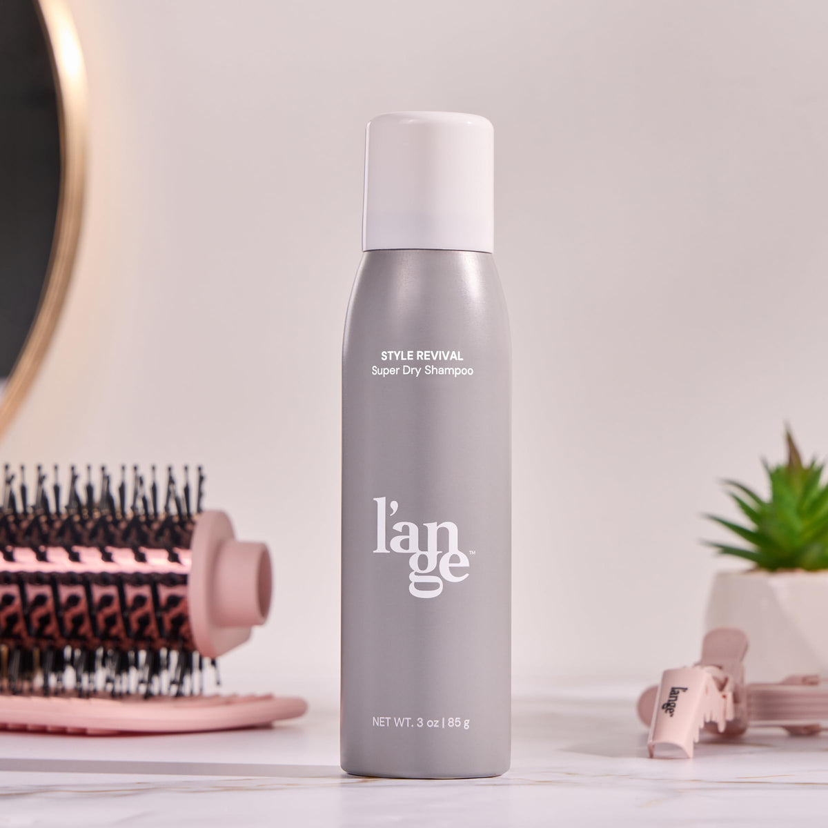 L'ANGE HAIR can in gym bag lifestyle shot, suggests quick refresh and odor control benefit