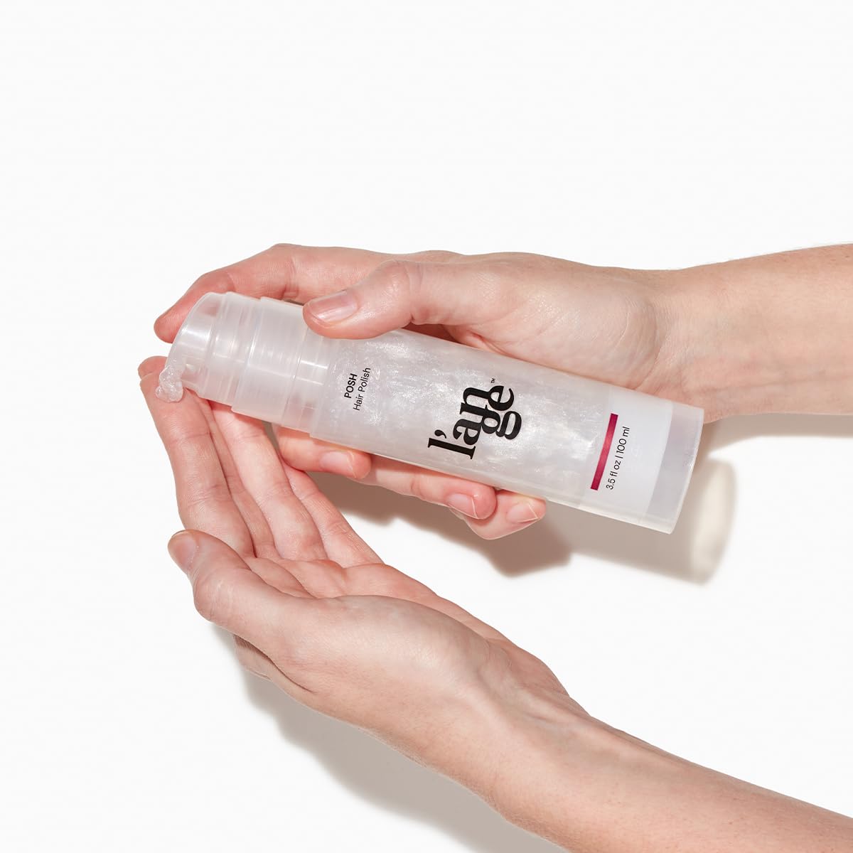 L'ANGE HAIR hands applying polish illustrating easy spread and better manageability