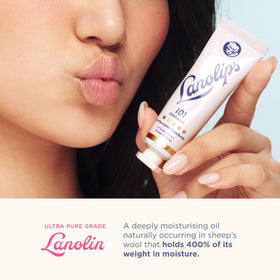 Lanolips applying ointment on lips closeup for quick hydration
