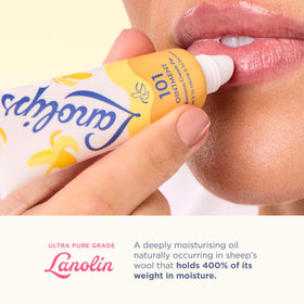 Applying Lanolips ointment to lips demonstrating soothing and barrier support