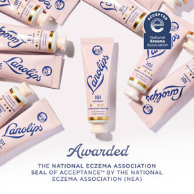 Lanolips tin beside travel essentials showing on-the-go hydration benefit