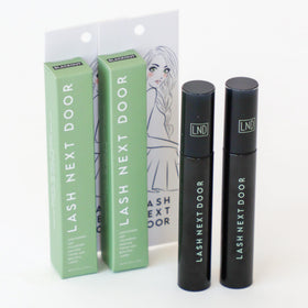 Lash Next Door tubes on bathroom vanity showing everyday routine compatibility benefit