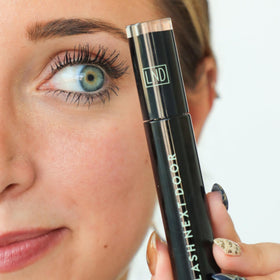 Lash Next Door on model daytime look showing natural lifted lashes benefit