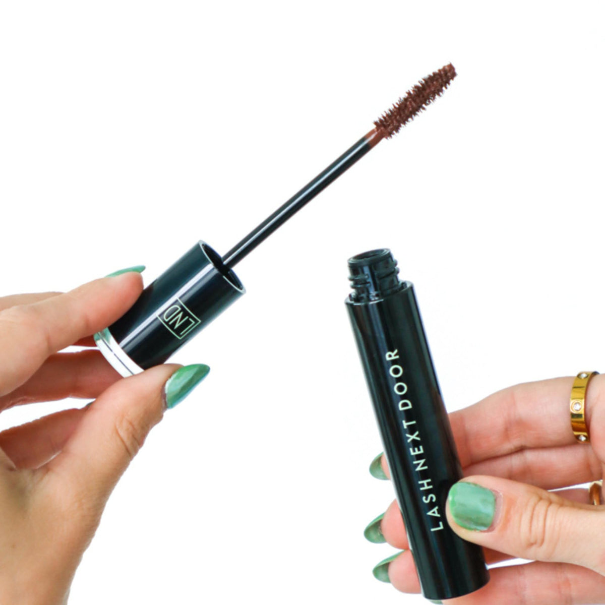 Lash Next Door swatch on skin showing espresso brown pigment and buildable coverage