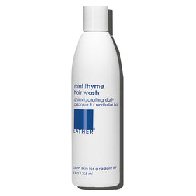 LATHER mint thyme hair wash front label showing product name and size, clear branding benefit