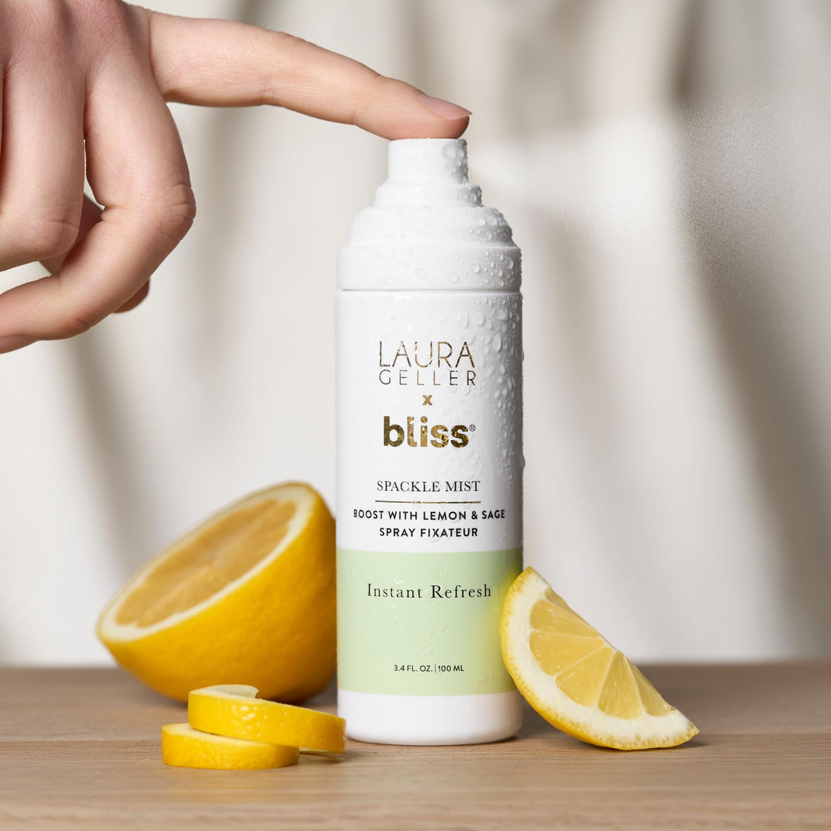 LAURA GELLER mist bottle inside a handbag for travel convenience and on-the-go refresh