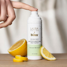 LAURA GELLER mist bottle inside a handbag for travel convenience and on-the-go refresh