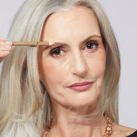 LAURA GELLER NEW YORK label close-up revealing product name and lightweight ingredient profile