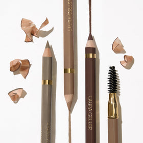LAURA GELLER NEW YORK pencil in hand to show compact size and portability