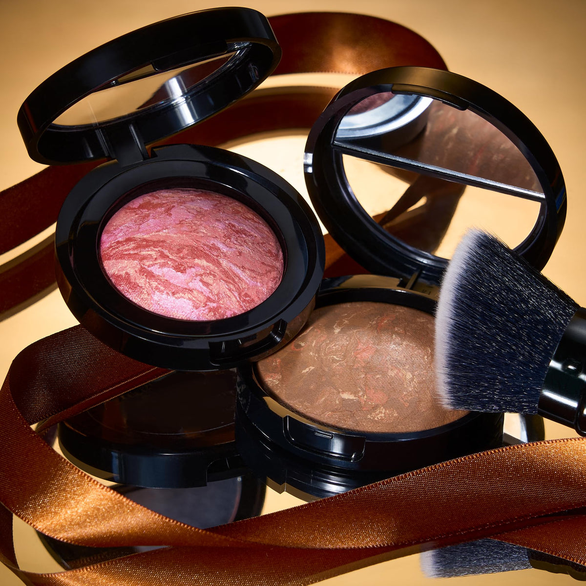 LAURA GELLER NEW YORK brush applying foundation for seamless buffing